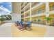 Community patio with table and chairs, perfect for relaxing at 501 Haben Blvd # 806, Palmetto, FL 34221