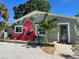 Cute bungalow with flamingo mural and landscaped yard at 5127 27Th S Ave, Gulfport, FL 33707