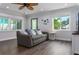 Bright living room with gray couch and coastal decor at 5127 27Th S Ave, Gulfport, FL 33707