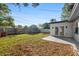 Spacious backyard with green grass, a patio, and a privacy fence at 523 Deville E Dr, Largo, FL 33771