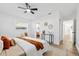 Spacious main bedroom has natural light, a ceiling fan, and walk-in closet at 523 Deville E Dr, Largo, FL 33771