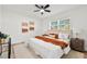 Comfortable main bedroom with soft decor, plush bedding, and two windows for natural light, a peaceful retreat at 523 Deville E Dr, Largo, FL 33771