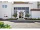 Modern building entrance with glass doors and landscaping at 6021 Bahia Del Mar Cir # 536, St Petersburg, FL 33715