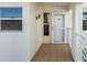 Condo entryway with tiled floor, white door, and screen door at 6021 Bahia Del Mar Cir # 536, St Petersburg, FL 33715