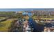 Wider aerial view shows the property's location on the canal and proximity to open water at 937 Bunker View Dr, Apollo Beach, FL 33572