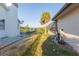 Landscaped backyard with canal view, offering privacy and tranquility at 937 Bunker View Dr, Apollo Beach, FL 33572