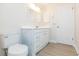 Bathroom with vanity, toilet and door at 937 Bunker View Dr, Apollo Beach, FL 33572