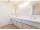 Bright bathroom with double vanity and modern lighting at 937 Bunker View Dr, Apollo Beach, FL 33572