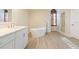 Bathroom boasts a free-standing tub and walk-in shower at 937 Bunker View Dr, Apollo Beach, FL 33572