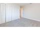 Bedroom with built-in closet and carpet flooring at 937 Bunker View Dr, Apollo Beach, FL 33572