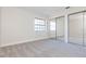 Bedroom with mirrored closet doors and carpet flooring at 937 Bunker View Dr, Apollo Beach, FL 33572