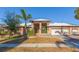 Brick home with a three-car garage and palm trees at 937 Bunker View Dr, Apollo Beach, FL 33572