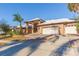 Front view of a brick house with a three car garage at 937 Bunker View Dr, Apollo Beach, FL 33572