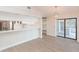 Eat-in kitchen with white cabinets, breakfast bar, and access to patio at 937 Bunker View Dr, Apollo Beach, FL 33572