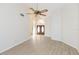 Spacious living area with wood-look floors, high ceilings, and an open floor plan at 937 Bunker View Dr, Apollo Beach, FL 33572