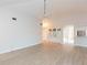 Bright living room with vaulted ceilings and laminate flooring at 937 Bunker View Dr, Apollo Beach, FL 33572