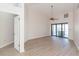 Bright living room with hardwood floors and sliding doors to pool area at 937 Bunker View Dr, Apollo Beach, FL 33572
