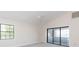 Main bedroom with sliding glass doors leading to a deck at 937 Bunker View Dr, Apollo Beach, FL 33572