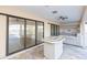 Outdoor kitchen with cabinets and sink overlooking pool at 937 Bunker View Dr, Apollo Beach, FL 33572