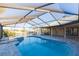Inviting pool and spa with screened enclosure at 937 Bunker View Dr, Apollo Beach, FL 33572