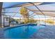 Relaxing screened pool and spa with water views at 937 Bunker View Dr, Apollo Beach, FL 33572