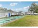 Community shuffleboard courts with building in background at 100 Glennes Ln # 108, Dunedin, FL 34698