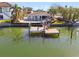 Aerial view of waterfront home with private dock and pool at 10208 Tarpon Dr, Treasure Island, FL 33706