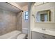 Bathroom features a vanity, toilet and tub at 11339 Gulfstream Blvd, Port Charlotte, FL 33981