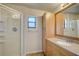 Second bathroom with shower stall, vanity, and built-in storage at 11339 Gulfstream Blvd, Port Charlotte, FL 33981