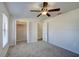 Bedroom with ceiling fan, closet, and a window with blinds at 11339 Gulfstream Blvd, Port Charlotte, FL 33981