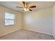 Spacious bedroom with ceiling fan and window at 11339 Gulfstream Blvd, Port Charlotte, FL 33981