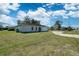 House exterior with driveway and lawn at 11339 Gulfstream Blvd, Port Charlotte, FL 33981