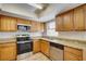 Granite countertops and stainless steel appliances in this kitchen at 11339 Gulfstream Blvd, Port Charlotte, FL 33981