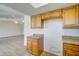 Light wood cabinets and granite countertops in this kitchen at 11339 Gulfstream Blvd, Port Charlotte, FL 33981