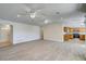 Open concept living area with wood floors and kitchen view at 11339 Gulfstream Blvd, Port Charlotte, FL 33981