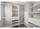 Spacious walk-in closet with built-in shelving and hanging rods at 13747 Forest Lake Dr, Largo, FL 33771