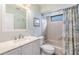 Clean bathroom with a bathtub shower combo and updated vanity at 14631 Village Glen Cir, Tampa, FL 33618