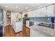 Updated kitchen with stainless steel appliances, granite countertops, and an island at 14631 Village Glen Cir, Tampa, FL 33618