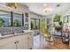 Eat-in kitchen with access to a private patio and neutral color palette at 14631 Village Glen Cir, Tampa, FL 33618
