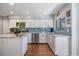 Modern kitchen with stainless steel appliances, granite countertops, and an island at 14631 Village Glen Cir, Tampa, FL 33618