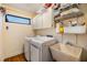 Convenient laundry room with washer, dryer, and utility sink at 14631 Village Glen Cir, Tampa, FL 33618