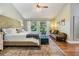 Spacious main bedroom with plush bedding and private access to a tranquil patio at 14631 Village Glen Cir, Tampa, FL 33618