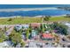 Stunning aerial view showcasing the waterfront property, adjacent pool and neighboring homes at 1925 Beach Se Dr, St Petersburg, FL 33705