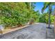Backyard featuring a concrete patio and lush green landscaping and perimeter fencing at 1925 Beach Se Dr, St Petersburg, FL 33705