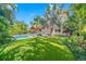 Lush backyard featuring a refreshing pool, shaded gazebo, and well-maintained lawn at 1925 Beach Se Dr, St Petersburg, FL 33705