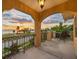 Picturesque balcony view of the beach at sunset, framed by elegant architecture and tropical landscaping at 1925 Beach Se Dr, St Petersburg, FL 33705