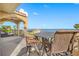 Relaxing balcony with wrought iron table and chairs offering beautiful panoramic waterfront views at 1925 Beach Se Dr, St Petersburg, FL 33705