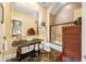 Stylish bathroom featuring a stone countertop sink, decorative mirror, and tiled shower at 1925 Beach Se Dr, St Petersburg, FL 33705