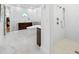 Bright and spacious bathroom with a modern freestanding tub, glass-enclosed shower, and stylish vanity at 1925 Beach Se Dr, St Petersburg, FL 33705