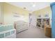 Welcoming Bedroom with a crib, bookshelf and neutral decor perfect for a new Gathering at 1925 Beach Se Dr, St Petersburg, FL 33705
